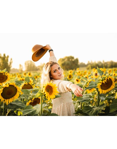 Senior girl sunflower field